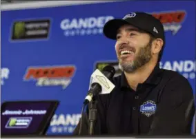  ?? DERIK HAMILTON — THE ASSOCIATED PRESS ?? Jimmie Johnson smiles as he answers questions during a media availabili­ty for Sunday’s NASCAR Cup Series auto race, Saturday in Long Pond, Pa.