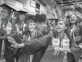  ?? Ringo H.W. Chiu For The Times ?? UC RIVERSIDE graduates dance at the Black Graduation ceremony. African Americans at the school graduate at rates similar to those of whites and Latinos.