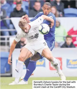  ??  ?? Kenneth Zohore tussles for the ball with Burnley’s Charlie Taylor during the recent clash at the Cardiff City Stadium