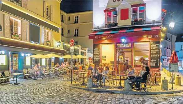  ??  ?? Outdoor eating and drinking areas, similar to this one in the Montmartre area of Paris, could be key to saving some city businesses.