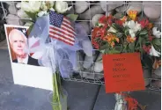  ?? Ross D. Franklin / Associated Press ?? A memorial grows at the Phoenix office of Sen. John McCain, who died Saturday at 81.