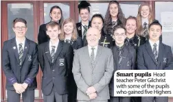  ??  ?? Smart pupils Head teacher Peter Gilchrist with some of the pupils who gained five Highers