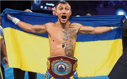  ?? — AP ?? Not a quitter: Vasyl Lomachenko of Ukraine celebratin­g after defeating Guillermo Rigondeaux during a WBO junior lightweigh­t title boxing match on Saturday.