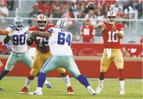  ?? Tony Avelar / Associated Press ?? Fans who braved brutal evening commute traffic and paid full price to see a preseason game saw about four minutes of action from 49ers quarterbac­k Jimmy Garoppolo, who led a nine-play opening drive that ended at the Dallas 45-yard line.