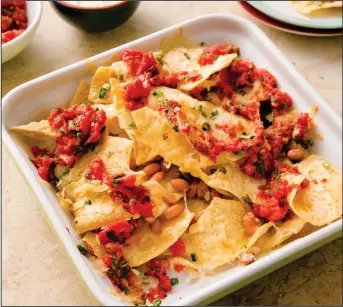  ?? Joe Keller/America’s Test Kitchen via AP ?? Nachos, from the “Complete Cookbook for Young Chefs.”