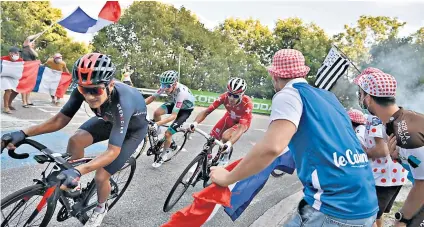  ??  ?? Chase is on: Breakaway riders press for victory during the 16th stage between La Tour-du-pin and Villard-de-lans yesterday