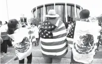  ?? Associated Press file photo ?? Protesters outside the federal courthouse in San Antonio take part in a rally June 26 to oppose a new Texas “sanctuary cities” bill that aligns with the president’s tougher stance on illegal immigratio­n.