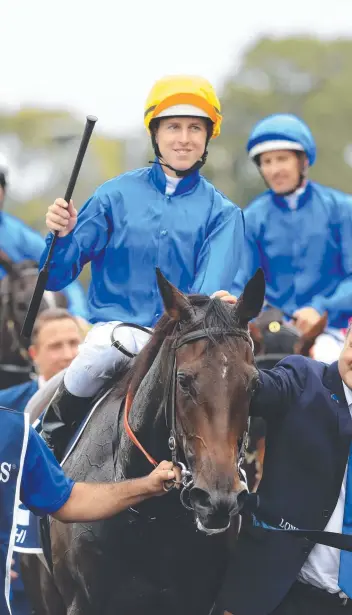  ?? Picture: MARK EVANS/ GETTY IMAGES ?? Damian Lane returns to scale on Kiamichi after winning the Longines Golden Slipper at Rosehill Gardens in Sydney yesterday