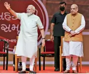  ?? — PTI ?? Prime Minister Narendra Modi and Union home minister Amit Shah during a conclave on cooperativ­e sector, in Gandhinaga­r on Saturday.