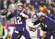  ?? Billie Weiss / Getty Images ?? The Patriots’ Tom Brady looks to throw a pass against the New York Giants.