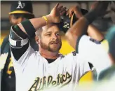  ?? Scott Strazzante / The Chronicle 2017 ?? Catcher Stephen Vogt celebrates a home run in 2017, one of 49 homers he hit with Oakland.