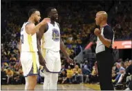  ?? ?? Golden State Warriors guard Stephen Curry, left, and forward Draymond Green (23) talk with referee Marc Davis during the second half of Game 1 of the NBA Finals against the Boston Celtics in San Francisco on Thursday.