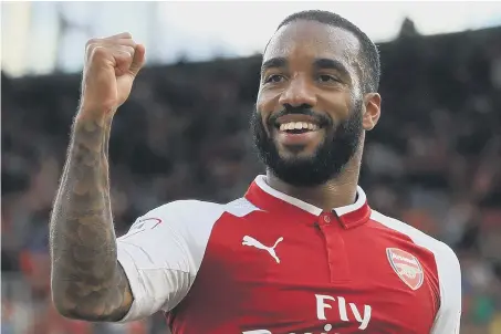  ??  ?? Big-money summer signing Alexandre Lacazette celebrates scoring his first Arsenal goal in yesterday’s 2-1 Emirates Cup defeat to Sevilla.