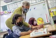  ?? Pool photo via ap ?? Joy Harrison instructs her second graders at carl B. munck elementary school, in oakland, calif,, on aug. 11. oakland is closing seven schools.