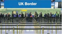  ?? Alamy ?? Passengers queue to enter the UK at Heathrow Airport