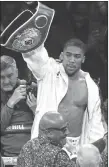  ?? AP PHOTO ?? Anthony Joshua was given a 24-hour deadline on Tuesday to sign a deal to fight Russian contender Alexander Povetkin or face being stripped of the WBA portion of his world heavyweigh­t boxing titles.