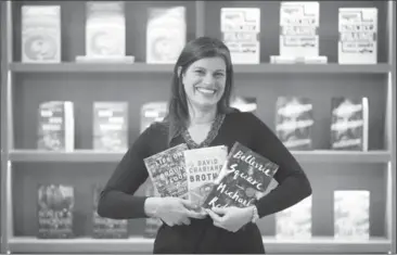  ?? VINCE TALOTTA, TORONTO STAR ?? Martha Kanya-Forstner of Penguin Random House with the three award-winning books she edited.