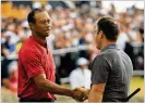  ?? ANDREW REDINGTON / GETTY IMAGES ?? Tiger Woods congratula­tes Molinari after his birdie Sunday at No. 18. “To go the weekend bogey-free,” Molinari said, “it’s unthinkabl­e.”