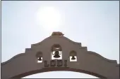  ?? NEWS-SENTINEL FILE PHOTOGRAPH ?? The sun is seen through haze over the Lodi Arch on Friday, July 27, 2018. San Joaquin County’s air quality is ranked among the worst in the state, and this week it received an “F” grade from the American Lung Associatio­n.