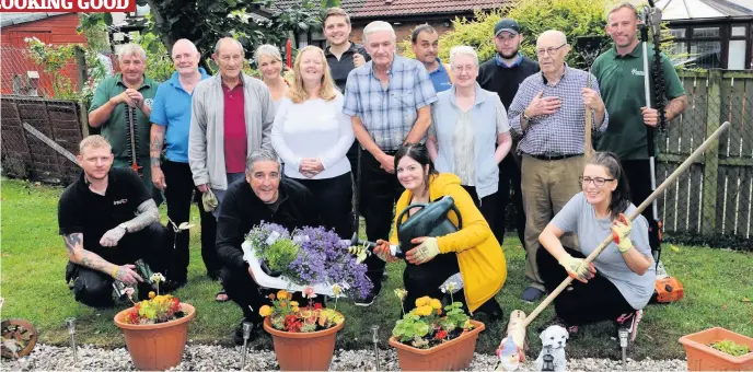  ??  ?? In full bloom Intu Braehead and Cardwell Garden Centre staff help with the garden makeover