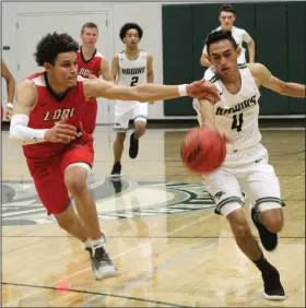  ?? MIKE BUSH/NEWS-SENTINEL ?? Lodi guard Jaylin Reed (3) and Liberty Ranch guard Jaime Gonzalez (4) go after the basketball in an area non-league boys basketball game at The Hawks Nest on Nov. 27.