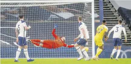  ?? (Photos: AP) ?? Fulham’s Ivan Cavaleiro (second right) scores his side’s goal during the English Premier League soccer match between Tottenham Hotspur and Fulham at the Tottenham Hotspur Stadium in London, yesterday.