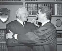  ?? Nick Ut Associated Press ?? ‘SOLOMON OF SMALL CLAIMS’ Judge Joseph Wapner, left, with his son Judge Frederick Wapner in 1989. He heard cases drawn from L.A.-area small claims courts on “The People’s Court.”