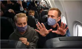  ?? Photograph: Kirill Kudryavtse­v/AFP/Getty Images ?? Alexei Navalny and his wife, Yulia, onboard plane bound for Russia.