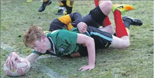  ??  ?? Angus Neil dives over to score for Oban Under-16 against Lochaber.