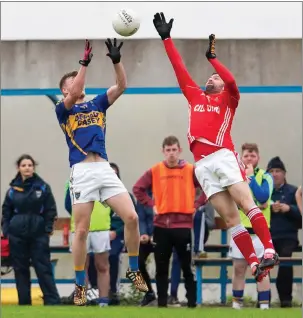  ??  ?? Kilshannig’s Dylan O’Callaghan catches a high ball that just eludes the reach of Kilworth’s Thomas Twomey last weekend in Kildorrery. Photo by Eric Barry