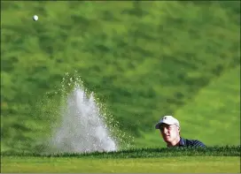  ?? MADDIE MEYER / GETTY IMAGES ?? Former Longhorn Jordan Spieth eyes his shot from a bunker at the 18th green to win the sudden-death playoff at the Travelers Championsh­ip.