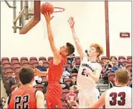  ?? Submitted/Steve Huckriede ?? Chase Austin, a Gravette junior, puts up a shot for two in play against Gentry on Dec. 18 at Gentry High Shcool. Casey Bates of Gentry was defending against the shot.