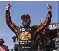  ?? (AP/Darren Yamashita) ?? Martin Truex Jr. celebrates after winning Sunday’s NASCAR Cup Series race at Sonoma Raceway in Sonoma, Calif. Truex won at Sonoma for the fourth time.