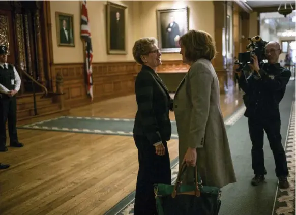  ?? PETER BREGG PHOTOS ?? Premier Kathleen Wynne stops to say hello to a friend on her way to a meeting at Queen’s Park in February. White Pine Pictures did a behind-the-scenes documentar­y for TVO.