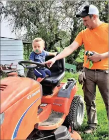  ?? PHOTO PROVIDED ?? Joel Young, now out of his wheelchair, helps son Lincoln climb aboard.