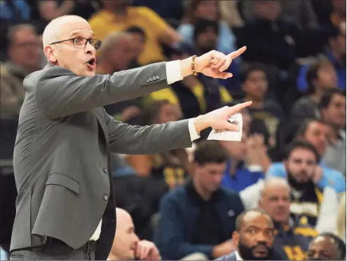  ?? Patrick McDermott / Getty Images ?? UConn coach Dan Hurley says his Huskies look “like a hungry team that’s finally kind of healthy again and excited to attack the schedule here.” UConn will play Butler twice this week.