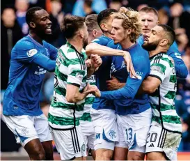  ?? SNS GROUP ?? Boiling point: players from Rangers and Celtic have a shoving match as tempers flare at Ibrox yesterday