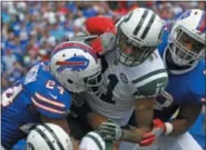  ?? JEFFREY T. BARNES — THE ASSOCIATED PRESS ?? Buffalo Bills' Leonard Johnson ( 24) and Preston Brown ( 52) tackle New York Jets' Robby Anderson ( 11) during the first half of an NFL football game Sunday in Orchard Park, N. Y.