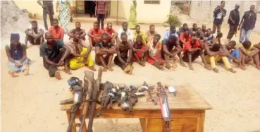  ??  ?? Cross section of suspected criminals and recovered illegal arms paraded by police in Lafia