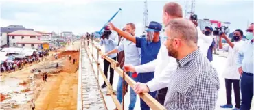  ?? Photo: NAN ?? Governor Nyesom Wike of Rivers State (3rd right) and officials of Julius Berger Nigeria PLC, during the inspection of three flyovers being built by the company in Port Harcourt yesterday