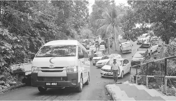  ??  ?? The cortege leaving Masing’s residence for burial at the Methodist cemetery.