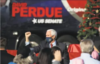  ?? Jessica McGowan / Getty Images ?? Vice President Mike Pence appears at a rally this month in support of Sen. David Purdue and Sen. Kelly Loeffler in Augusta, Ga. A win by one of them would keep the Senate in GOP hands.