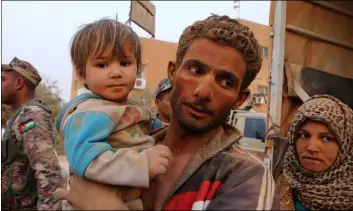  ??  ?? In this 2015 file photo, Syrian refugees covered in dust arrive at the Trabeel border after crossing into Jordanian territory from Syria, near Ruwaished, Jordan. AP PhOtO/RAAd AdAyleh