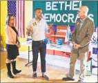  ?? H John Voorhees III / Hearst Connecticu­t Media ?? Raghib Allie-Brennan, center, a Democrat running for the state House in the 2nd District, held a LGBTQ day of action with State Comptrolle­r Kevin Lembo, right, and Julie Kushner, running for State Senate in the 24th district, on Saturday in Bethel.