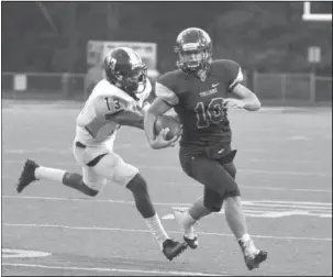  ?? The Sentinel-Record/Mara Kuhn ?? ON THE MOVE: In the Class 5A conference for both teams, Hot Springs quarterbac­k Korey Wasson (10) tries to elude Watson Chapel defender Alex Herrien in Friday night’s game at Reese Memorial Stadium. Hot Springs goes on the road against Hope (next week)...