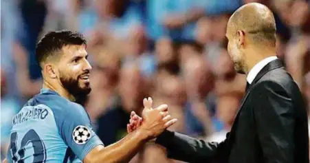  ??  ?? Guardiola (kanan) tetap tagih khidmat Aguero musim ini.