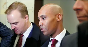  ??  ?? Attorneys Peter Wold, Thomas Plunkett and Noor enter the courthouse prior to the start of the murder trial in Minneapoli­s, Minnesota. — Reuters photo