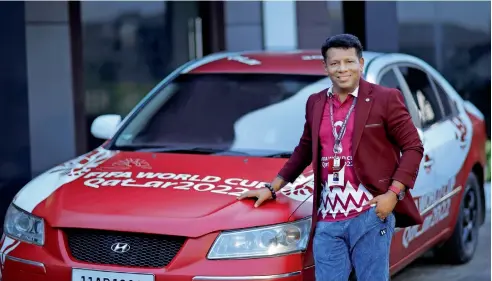  ?? ?? Dr. Khan with FIFA World Cup Qatar 2022 branded car at a roadshow.