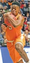  ?? THE ASSOCIATED PRESS ?? Tennessee forward Admiral Schofield drives against Georgia during the second half Thursday.