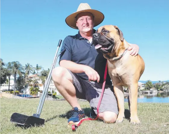  ??  ?? Paul Reimer is charging $15-45 to clean up dog poo from people’s backyards. He’s even offered “20 poo cent off”. Picture: RICHARD GOSLING